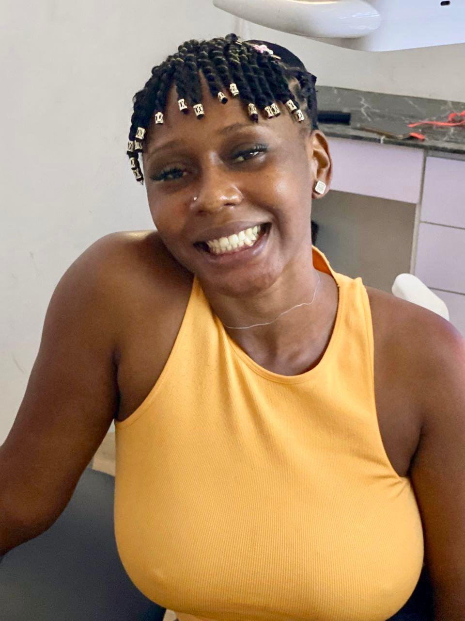 Patient smiling after treatment at Pristine Grin Dental, Lagos